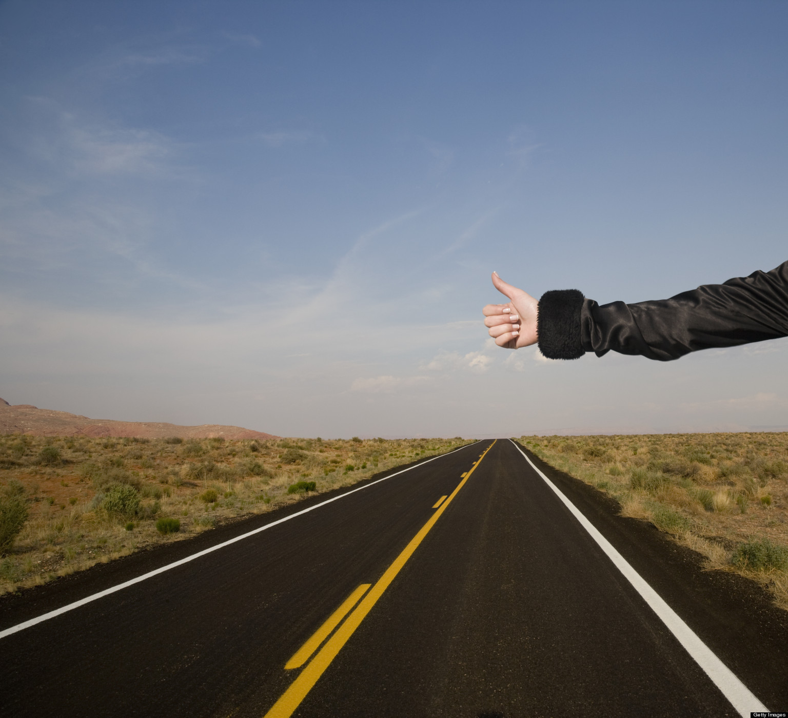 Hitch hiker on deserted road